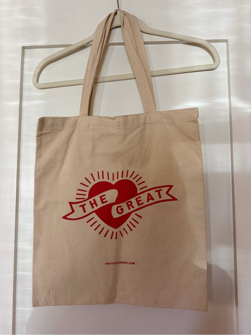 THE GREAT. Cream Canvas Tote with Red Heart Logo